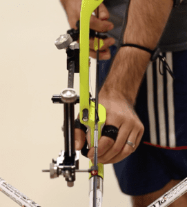 recurve archer showing grip and hook position at set from front