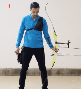 archer showing recurve set position with bow on foot