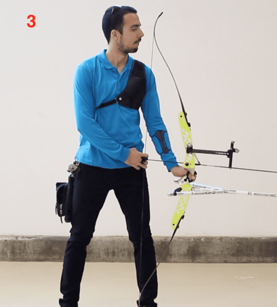 archer showing hand position and bow hand in grip