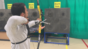 Archer showing how to learn the recurve bow hand follow-through 1