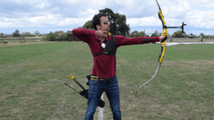 Recurve olympic archer showing release & follow through 1