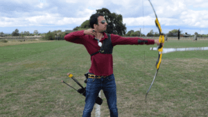Recurve olympic archer showing release & follow through 2