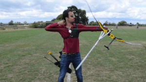 Recurve olympic archer showing release & follow through 4