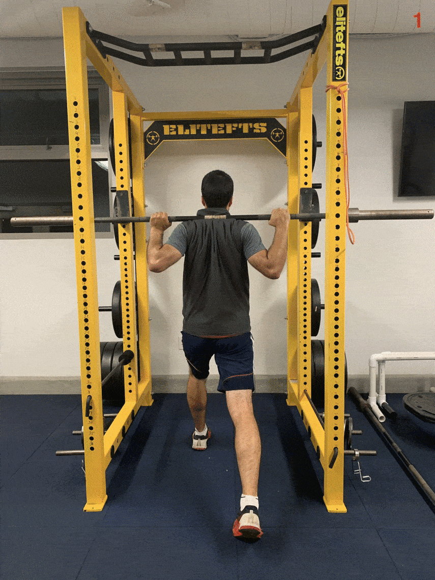 recurve archer showing barbell split squat